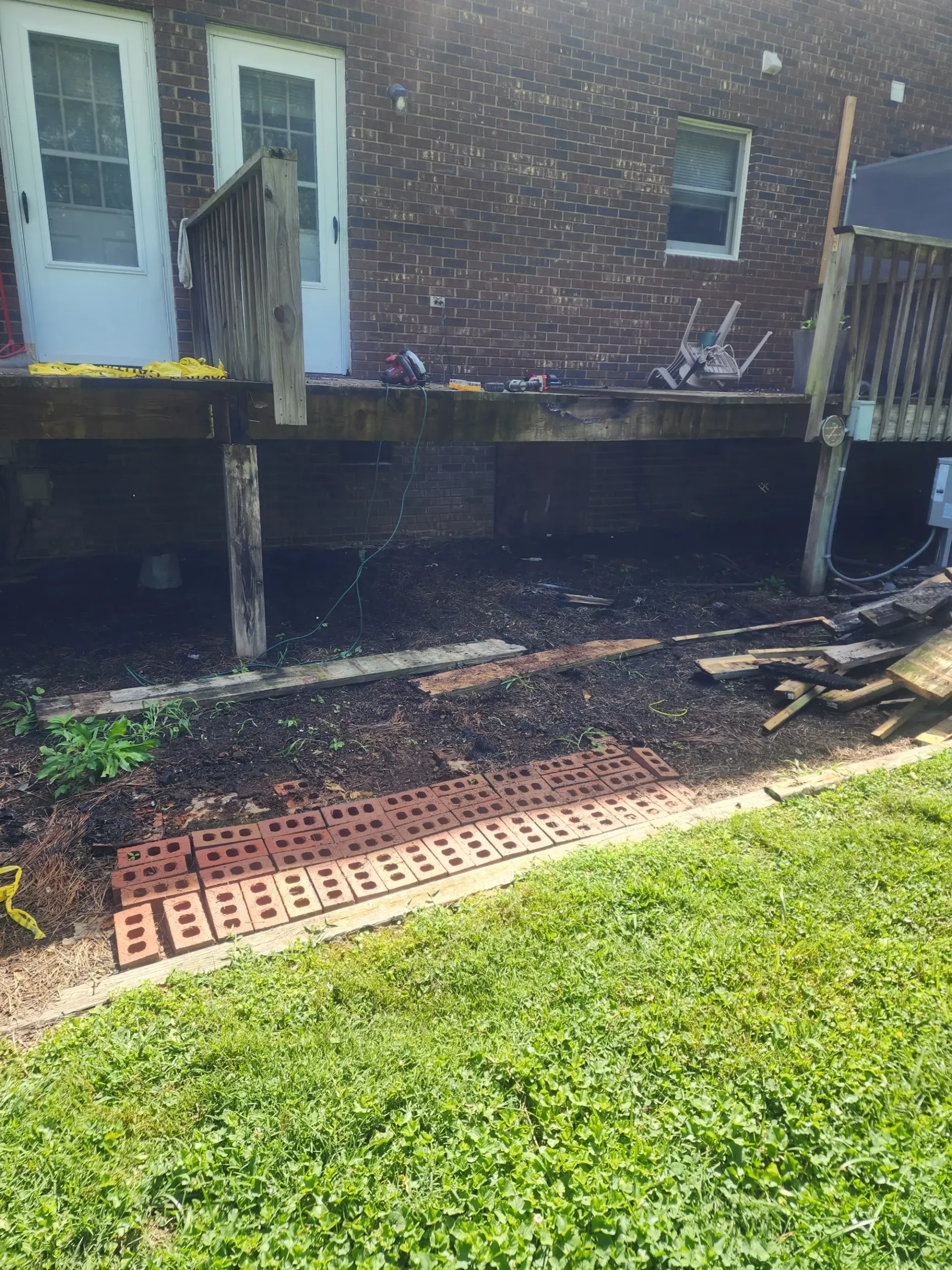 Finished wood deck and stairs by Footer to Ridge Construction