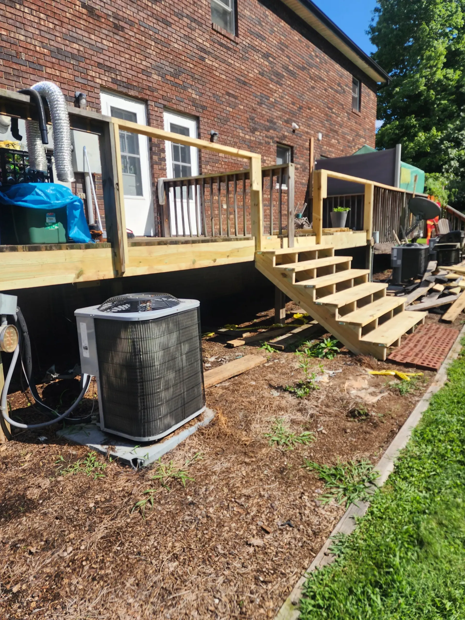 Finished backyard deck by Footer to Ridge Construction