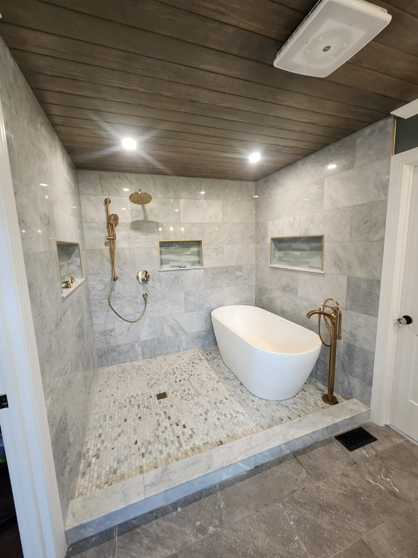 Finished bathroom tile work by Footer to Ridge Construction