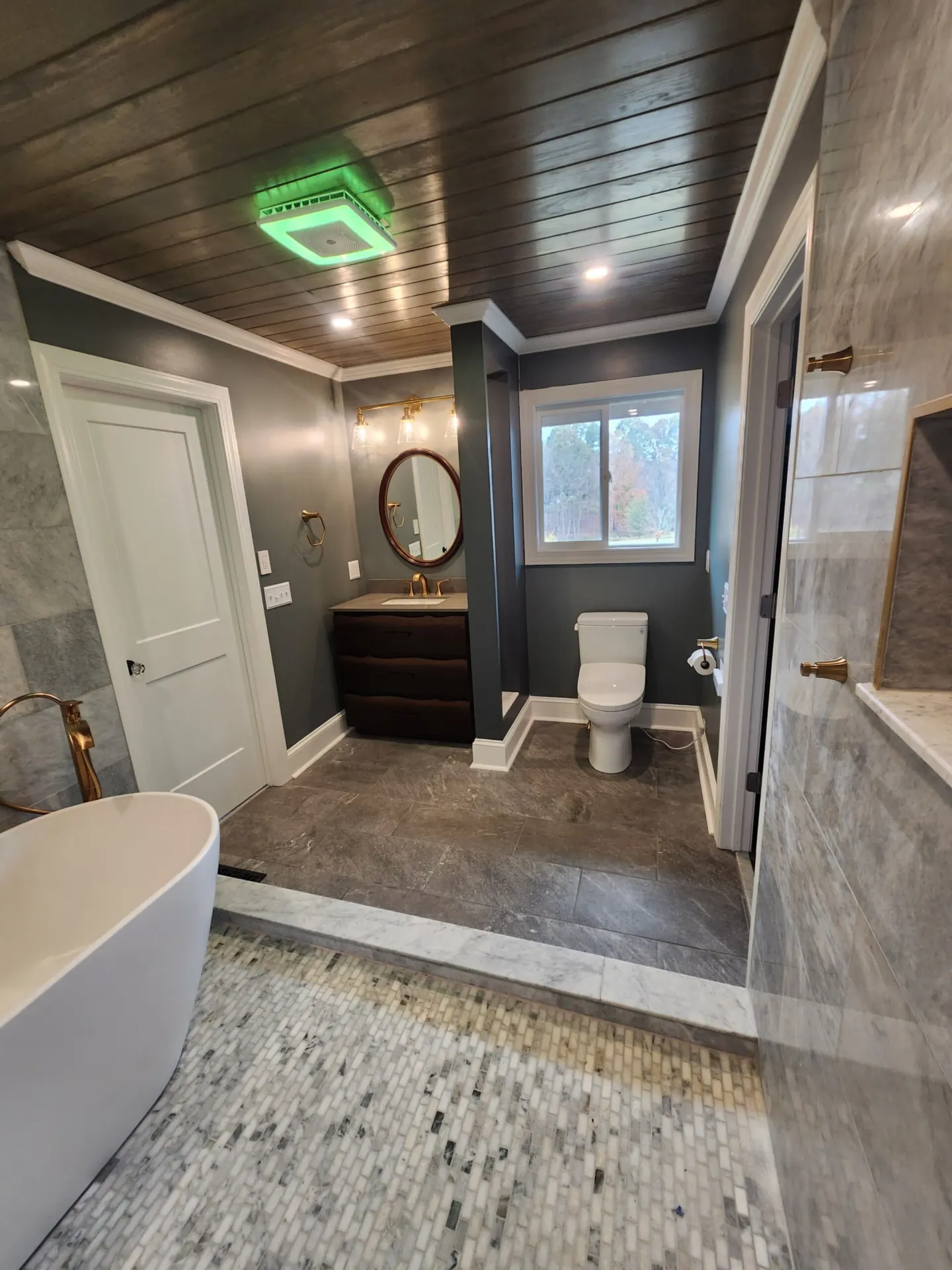 Finished bathroom remodel and tile installation by Footer to Ridge Construction